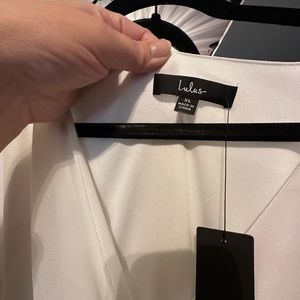 BRAND NEW WITH TAGS. WHITE LULUS DRESS.